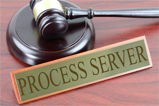 Legal process server with gavel and process server sign for Maryland legal document service.